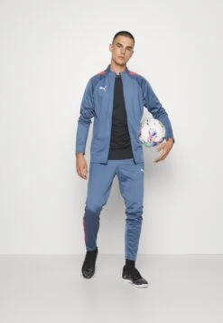 Puma Teamliga TracksuitTutaInky Blue/Fire Orchid Uomo Abbigliamento PU142K02M-K13 -Montavia Avventura Negozio c1e22287a6654daeaf7827c5195ca99e